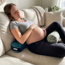 Colorful velvet small yoga bolsters in pink, blue, and yellow, designed to support various body parts by wobble yoga and provide pregancy relief
